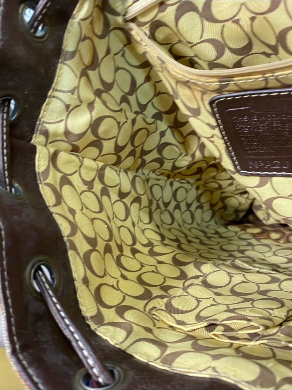 C Brown and Tan Signature Canvas Backpack